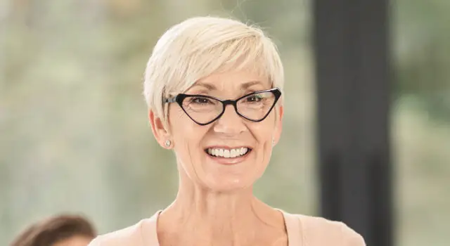 happy senior woman wearing eyeglasses