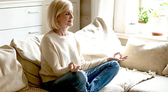 sitting on sofa being mindful